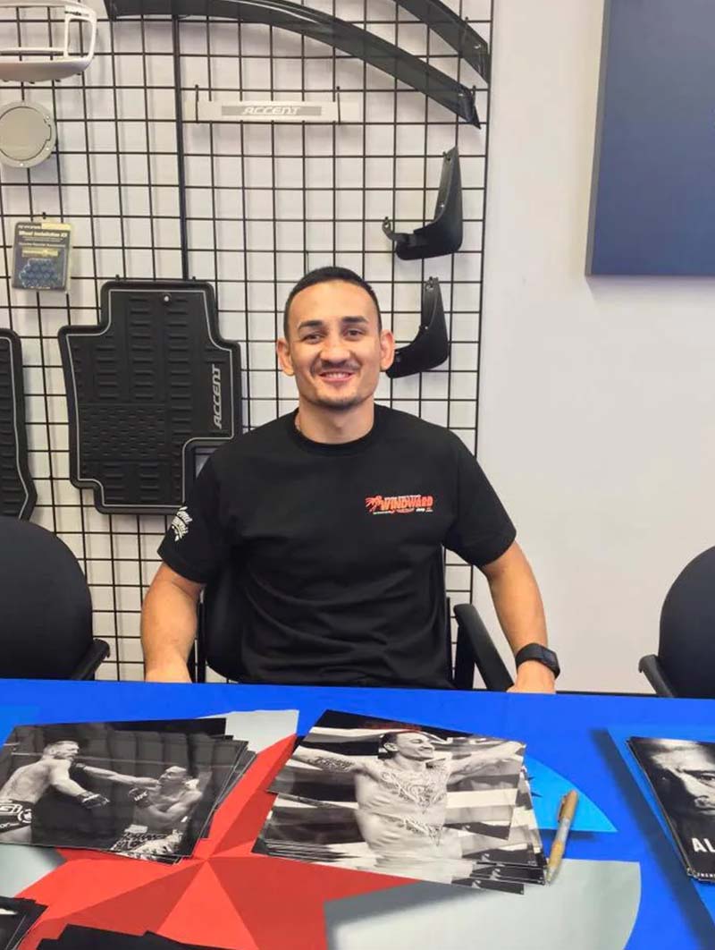 Peter's Special Project and UFC Champion Max Holloway at Windward Hyundai signing autographs